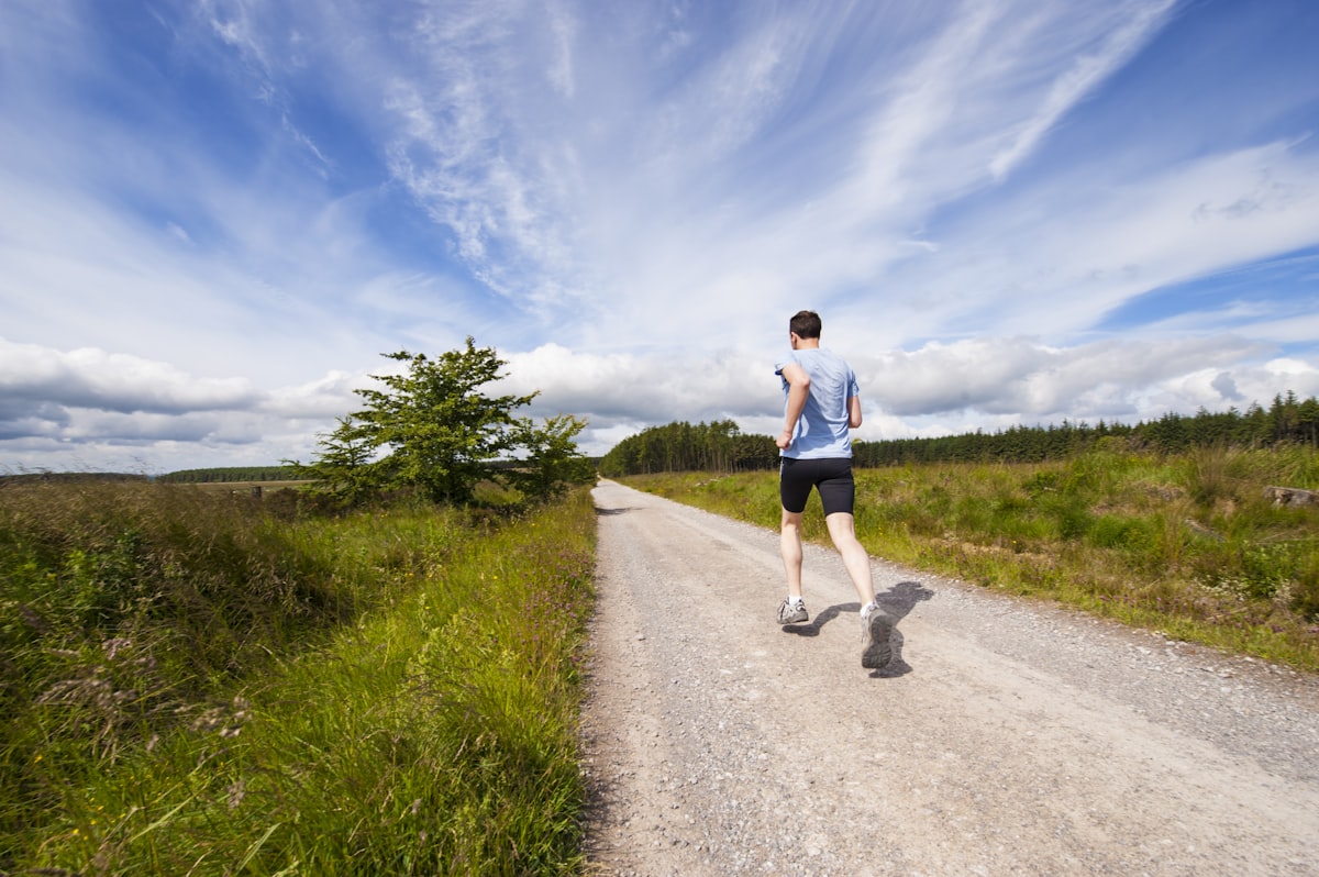 Runner on an open trail in motion