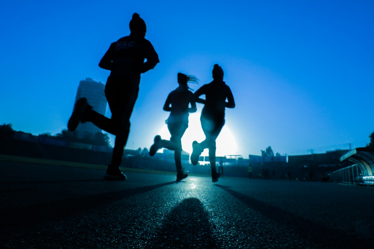 Close-up of running shoes contacting the ground